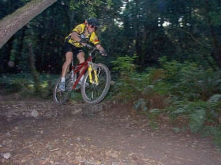 Rick Oswald jumping log